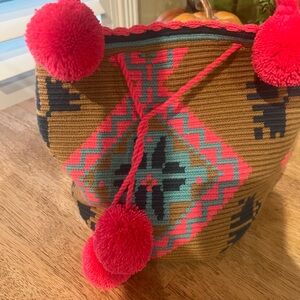 Knit Bag made in Mexico hot pink with Pom Poms new has 2 stains see pic of strap